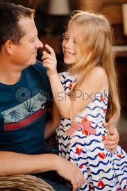 Hairstyles for winter that are easy and fun, stacked braids, fishtail braids, half up half down winter hairstyles that are. Dad Is Having Fun With Cute Blonde Daughter Stock Photo Crushpixel