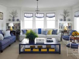 Turn Living Room With Yellow Accent Decor Furnished With White And Blue Sofas Black Coffee Tabl Yellow Living Room Cottage Style Living Room Blue Living Room
