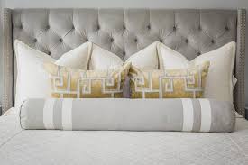 Because the table is black, it contrasts with the crisp white kitchen but it also ensures coherence throughout. Gray Bedroom With Gold Accents Transitional Bedroom