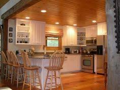 White Cabinets In Wood Cabin Kitchen Cabin Kitchens Pine Kitchen Pine Walls