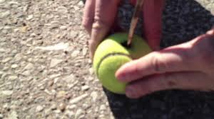 How to unlock a locked car using a tennisball. Can We Break Into A Car With A Water Bottle Tennis Ball Or Coat Hanger Youtube