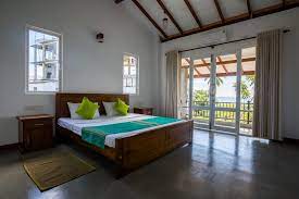 Simply walk outside to feel the sun on your face at the white sand beach. Blue Sands Beach Resort Bed Breakfast Pasikuda