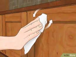 Cabinets directly above the range are most prone to grease stains. 3 Ways To Clean Wood Kitchen Cabinets Wikihow Life