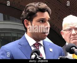 Fall River Mayor Jasiel Correia speaks beside his attorney Kevin Reddington  outside the federal courthouse, Friday, Sept. 6, 2019, in Boston, after his  appearance