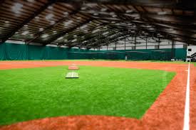 Soccer field with green grass and lights. Hoover Field Wichita S Largest Indoor Baseball Practice Facility