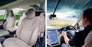 Factory cream model x interior with oak wood steering wheel and 2nd row center console. 2017 Tesla Model X P100d Drive