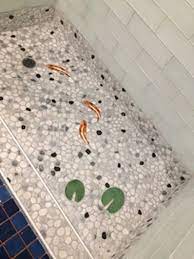 The small size of the individual tiles means they conform to the slope and shape of the shower floor better than a larger tile would. Pin On Ceramic Floor Designs