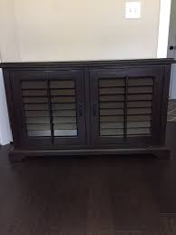 Constructed from hardwood and veneers over mdf, this type of material is usually not strong enough to be completely stripped and stained. Pottery Barn Holstead Shutter Small Media Console Cabinet For Sale In Huntersville Nc Offerup