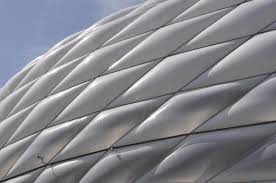 The white oval building symbolizes an abstract sculpture in the landscape. Allianz Arena Frottmaning 2005 Structurae