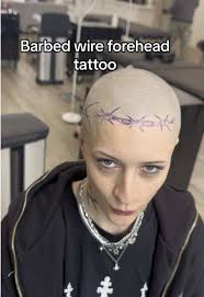 Image result for quirky pylon forehead tattoo