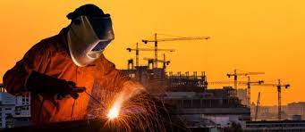 Industrial Worker Welding Steel Structure For With Construction Site In Background In 2021 Welding Consumables Welding Background