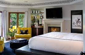 A white ceiling and white bedding keep black walls soft. Bold Black And White Bedrooms With Bright Pops Of Color