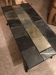 This gray slate round modular coffee table is a perfectly round, low table. Signature Design By Ashley Antigo Slate Tile Raised Coffee Table Big Lots