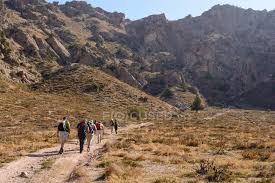 In uzbekistan, winter is mild. Uzbekistan Tashkent Province Bustonlik Tumani People Hiking In Chimgan Mountains Beauty In Nature Looking At View Stock Photo 198847746