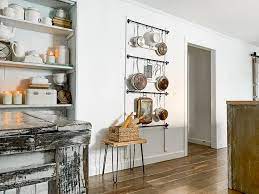 It's an old solution, but it can be an elegant one that also saves storage space. Diy Farmhouse Kitchen Pot Rack Organization Ikea Hack Using Fintorp Rail And S Hooks We Lived Happily Ever After