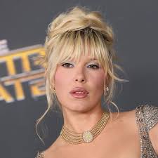 Millie Bobby Brown coins it a 'cherry red autumn' in cosy mini shorts and a  matching sweatshirt