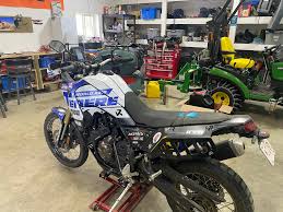 Before and after the acerbis tank install. All stickered up and ready to  roll!