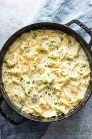 Simply cook all the ingredients together in a saucepan until smooth. Creamy Tortellini Alfredo With Peas Nourish And Fete