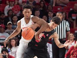Each team tries to score by tossing the ball through the opponent's goal, an elevated horizontal hoop and net called a basket. The Practice Wars That Made Houston College Basketball S Most Unlikely Super Team