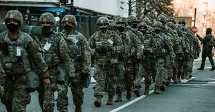 Hundreds of national guard members were spotted throughout wednesday cradling their rifles and riot gear as they slept on the stone floor of the capitol building. Pdnfepi0vxstbm