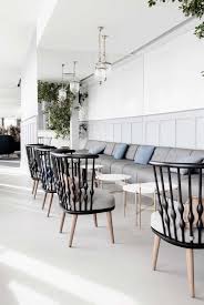 Commercial Restaurant Cushioned Bench Seating Circular Tables Chairs And Hanging Lights Restaurant Decor Cafe Interior Interior Design