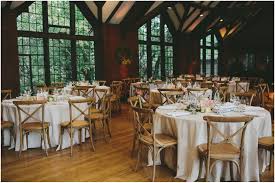 Circular Tables With Off White Tablecloths And Wooden Chairs White Table Cloth Circular Table Table Decorations