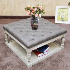 Upholstered firm for use as an ottoman / coffee table. Cairona Fabric 30 Inch Tufted Shelved Ottoman Optional Colors