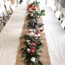An Australian Table Runner Made From Native Plants And Flowers Featuring A Cake Christmas Decorations Australian Australian Christmas Christmas Table Settings