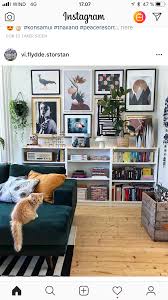 Chair Rail Height Shelves Married With Gallery Wall Fronted By A Deep Teal Couch And Grounded With Warm Eclectic Living Room Home Living Room Apartment Decor