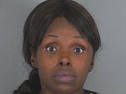 Woman charged with stabbing father of unborn child