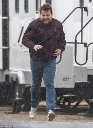 Yes corden's father was a musician in the royal air. James Corden Shows Off Slimmer Physique As He Dashes Through The Rain Daily Mail Online