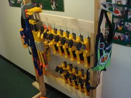 Used various hooks, wood screws, and nails to mount the guns. Nerf Storage Ideas A Girl And A Glue Gun