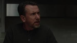 Long Sleeve Henley Tee in black worn by Peter Edgar (Tim Roth) in Luce