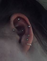 forward helix piercing flat piercing snug piercing triple lobe piercings triple forward helix piercing forward helix piercing triple lobe piercing