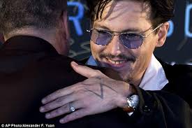 The engagement ring Johnny Depp gave Amber Heard was 'too big for her so he  started wearing it' himself