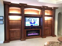 White gloss composite floating entertainment center fits tvs up to 80 in. Custom Entertainment Centers Custom Wall Units Orlando Fl Custom Cabinetry