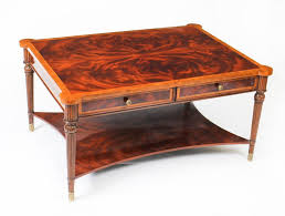 Note the elegant design of the piece and the metallic. Flame Mahogany Coffee Table With Four Drawers 20th Century For Sale At 1stdibs
