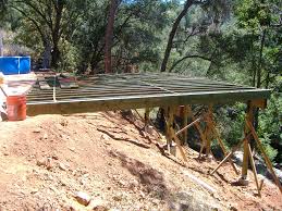 I like the way they used container plants to anchor the deck visually. Building A 24 X 20 Deck On Steep Slope 5 Steps With Pictures Instructables