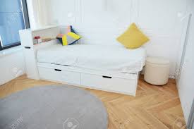 Modern bedroom bed with stylish lights this stylish and modern bedroom design is great for luxury homes. Modern Bedroom Interior Design With Luxury White Child Bed Contemporary Interior Design And Cozy Carpet Children S And Kids Room Stock Photo Picture And Royalty Free Image Image 107592524