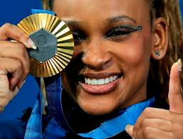 Elise Ray Appreciation — Rebeca Andrade celebrates winning the gold medal...