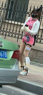 for those who are wondering, the chinese characters on her leg say  prostitute : rtrashy