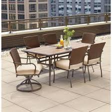 Hampton Bay Oak Cliff 7 Piece Outdoor Dining Set With 4 Stationary 2 Swivel Chairs And Chili Cushions 176 411 7d V3 The Home Depot Patio Dining Furniture Outdoor Dining Set Patio Furniture Sets