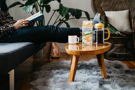 Winter holidays, resting pretty woman bare feet and legs lying up on stylish table, window view of snow landscape and frozen lake. Earth S Own On Twitter Kick Your Feet Up It S The Weekend Who S Unwinding After A Long Week Cashew On The Couch Drinksofresh