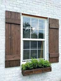 Wood shutters can be painted or stained to match your home and changed if you repaint the house. Why Painting Exterior Wood Shutters Is Important Exterior Wood Shutters Custom Exterior Window Shutter Tra Wood Shutters Exterior House Shutters Exterior Brick