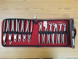 Small stainless steel extraction forceps. Types Of Tooth Extraction Forceps Upper And Lower Forceps In Kit Dentalkart Youtube