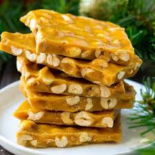 A Stack Of Peanut Brittle Pieces On A Serving Plate Peanut Brittle Recipe Brittle Recipes Peanut Brittle