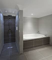 #cree #diy #retrofit if you have a down light that is old as balls, this inexpensive light can seriously upgrade the look of your bathroom with a relatively. Soft Lighting And Dramatic Tile Blend Perfectly Http Www Devinebath Com Bathroom Best Bathtubs Bathtub Tile Bathroom Layout