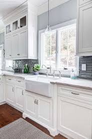 White shaker cabinets with matte black hardware. How To Match Cabinet Hardware With Kitchen Decor