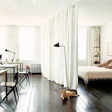 How To Create A Bedroom In A Studio Apartment Small Spaces Room Divider Curtain Apartment Living