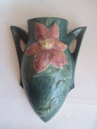 Measures 7 1/4 high, 5 wide and base 3 1/4 will ship insured, either 21 Roseville Clematis Ideas Roseville Clematis Roseville Pottery